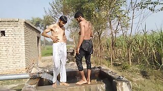Pakistani villagers have fun in tubewell