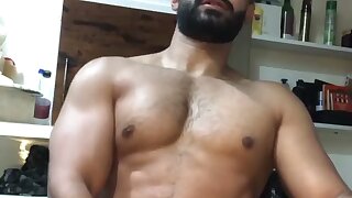 Handsome hunk stroking his thick cock